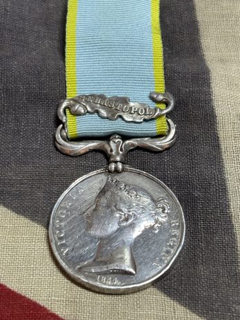 Crimea medal with Sebastopol clasp. Sheehan. 57th Foot. Limerick. Gunshot to neck in trenches June 1855.